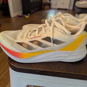 Adidas White Sneakers with Red and Yellow Highlights
